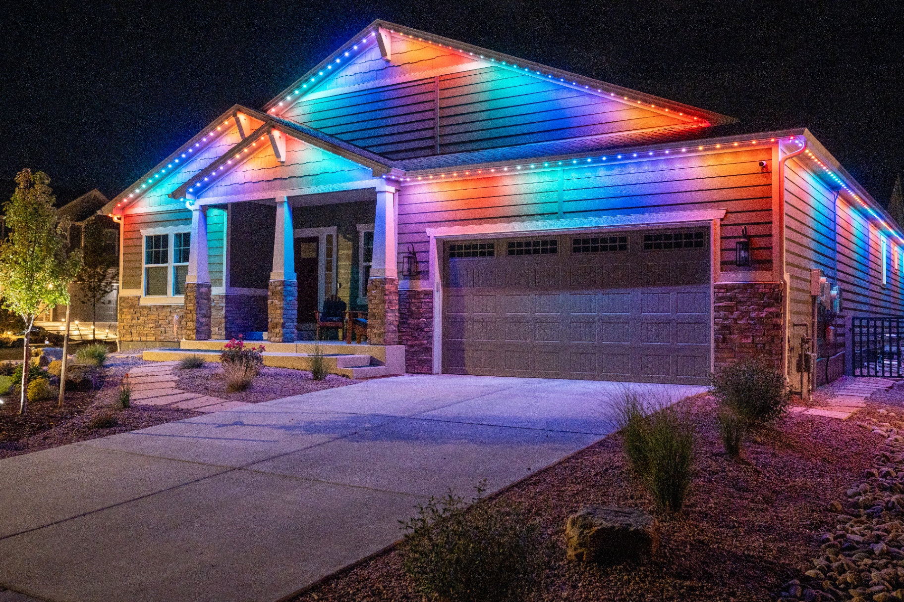 Full rainbow lighting on a craftsman-style home
